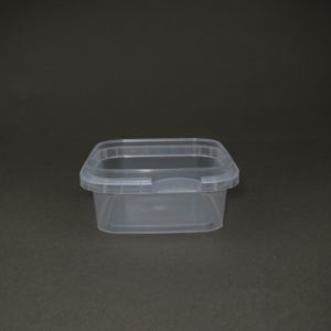 A plastic container sitting on top of a table.