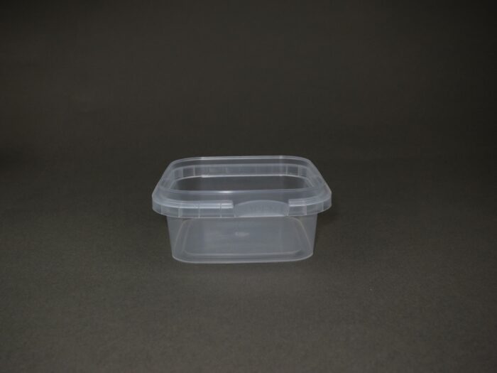 A plastic container sitting on top of a table.