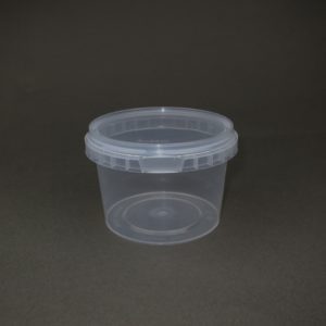 A plastic container with a lid on the table.