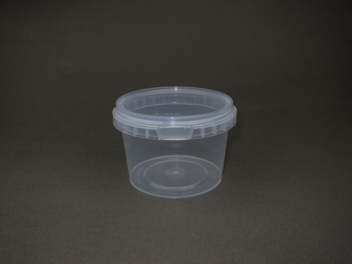 A plastic container with a lid on the table.