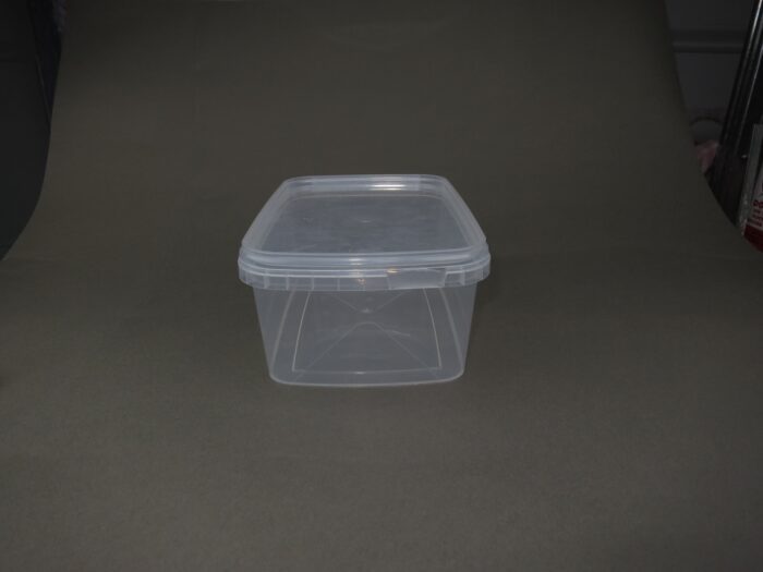 A plastic container sitting on top of a floor.