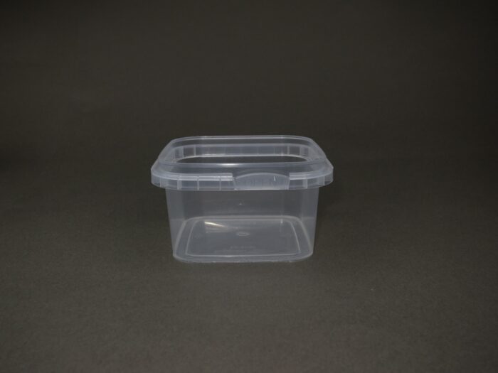 A plastic container sitting on top of a floor.