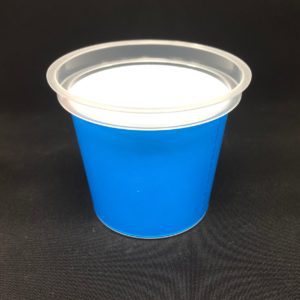 A blue cup with white lid on black surface.