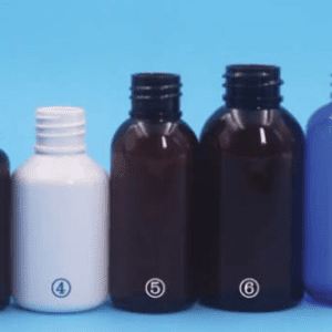 A row of bottles on top of a blue background.