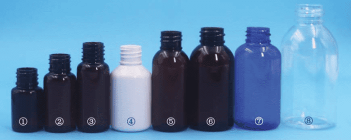 A row of bottles on top of a blue background.